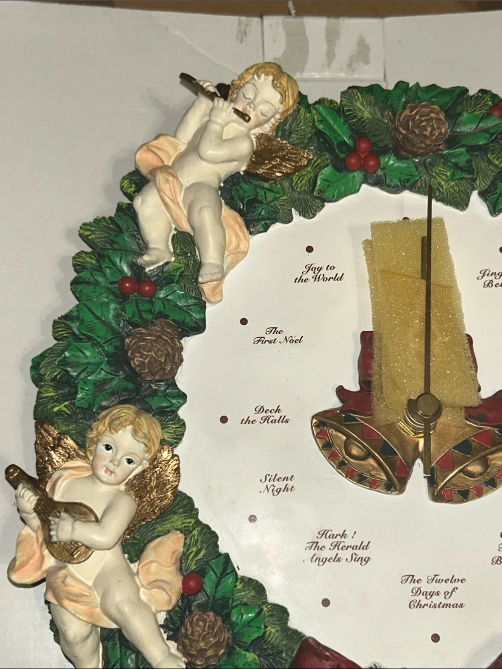 Musical Christmas Wreath Clock with Cherubs, sings a different song every hour